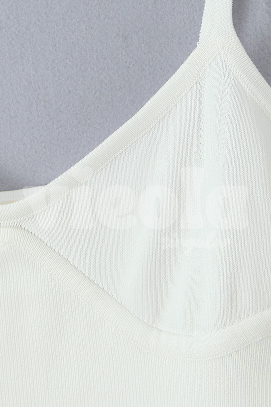 Close-up of a light gray tank top on a gray background